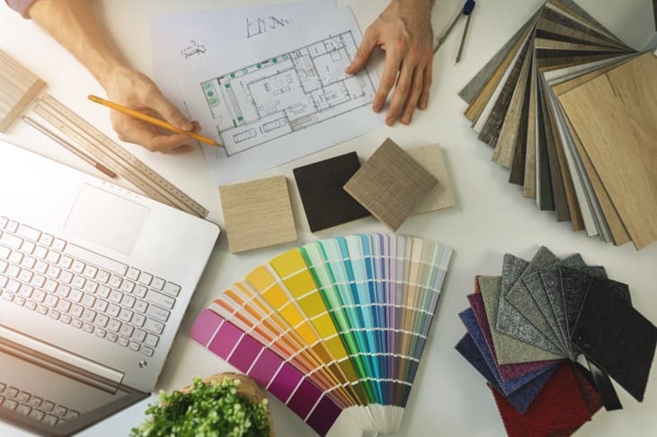 A person working on some color samples